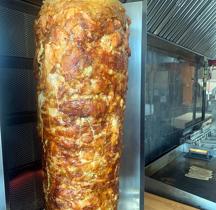 Chicken doner spit roasting in the Donair Istanbull kitchen
