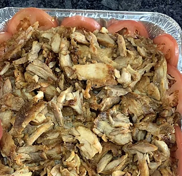 Family tray of sliced chicken shawarma